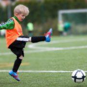 Boy Kicking Soccer Ball